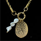 gold charm with fresh water pearls